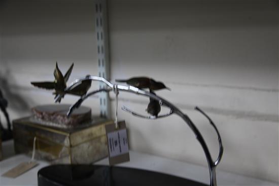 A French Art Deco silvered and painted bronze figure group, modelled as four humming birds, 13.75in.